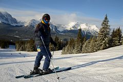 06 Charlotte Ryan Skiing Just Below Glacier Chairlift With Mount Temple and Mount Victoria Behind
